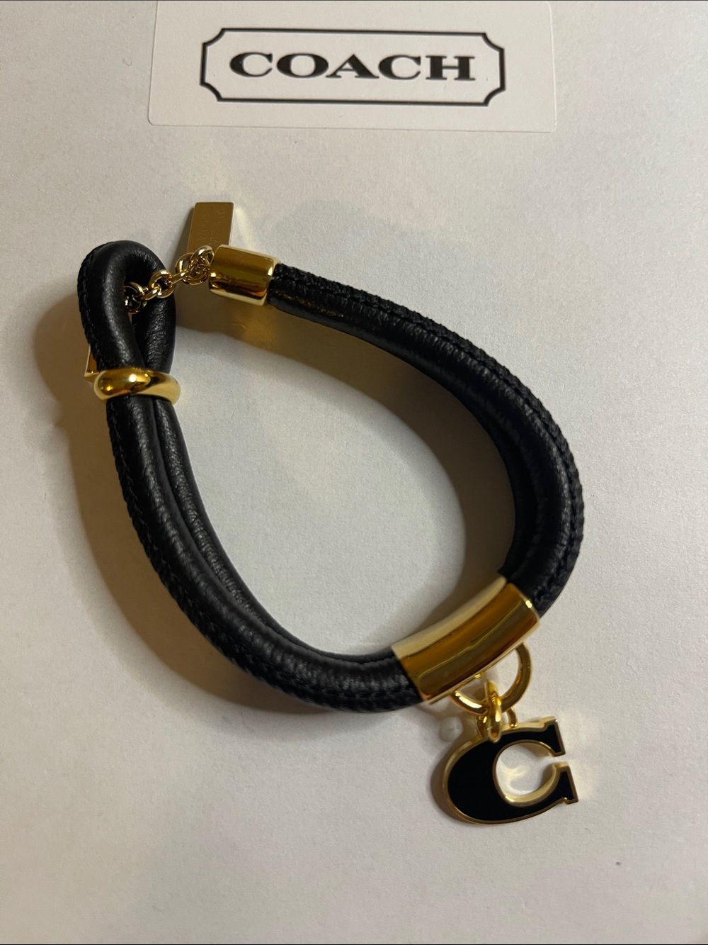 Coach Bracelet in Black and Gold